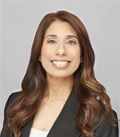 A headshot of Sajani Granquist, a South Asian woman with wavy hair in a black blazer.