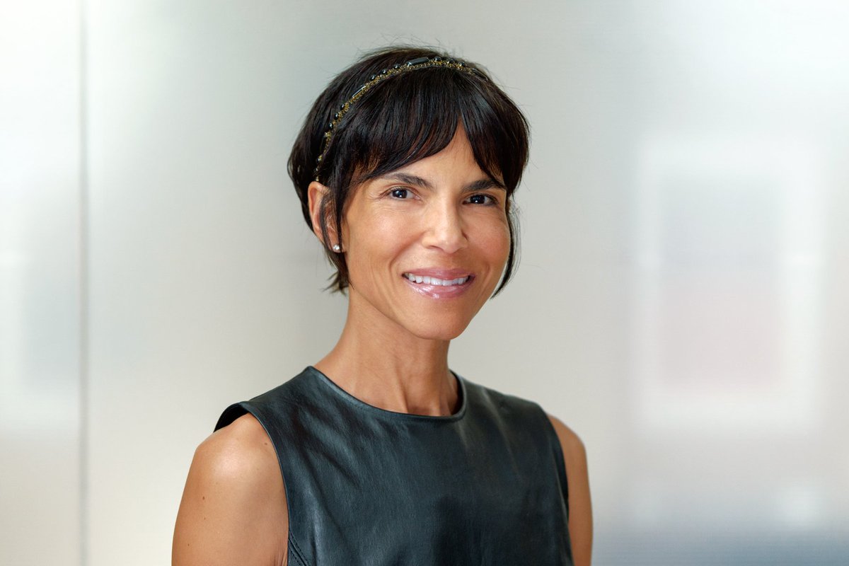 Headshot of Joyce Smith, a woman in gray shirt smiles at the camera