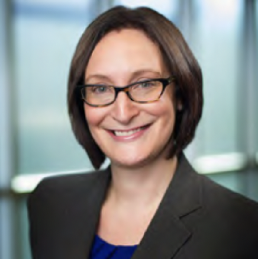 Headshot of Robyn Diaz, a woman in glasses smiling at the camera